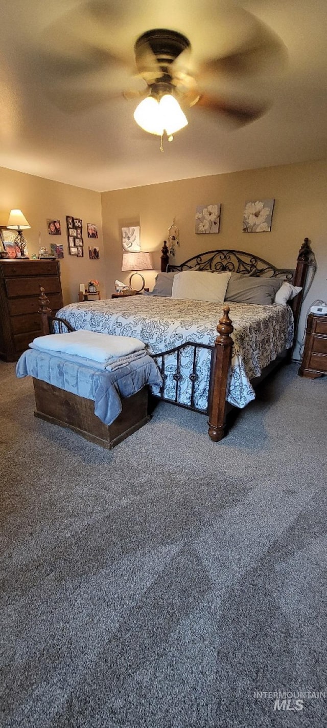 carpeted bedroom featuring ceiling fan