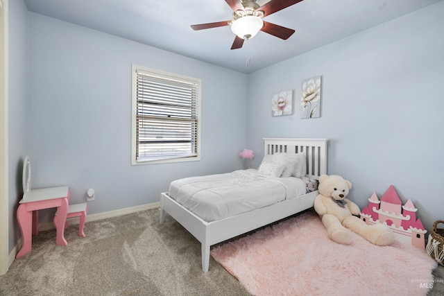 carpeted bedroom featuring a ceiling fan and baseboards