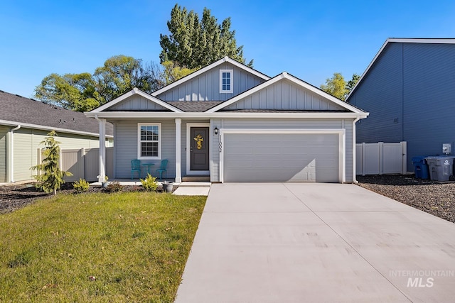 11002 W Hidden Point St, Star, ID 83669 - view of front of house featuring a porch, board and batten siding, an attached garage, and driveway
