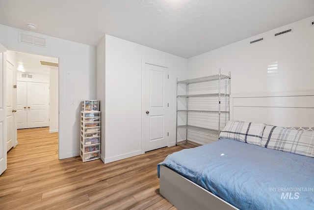 11002 W Hidden Point St, Star, ID 83669 - bedroom with light wood-type flooring and baseboards