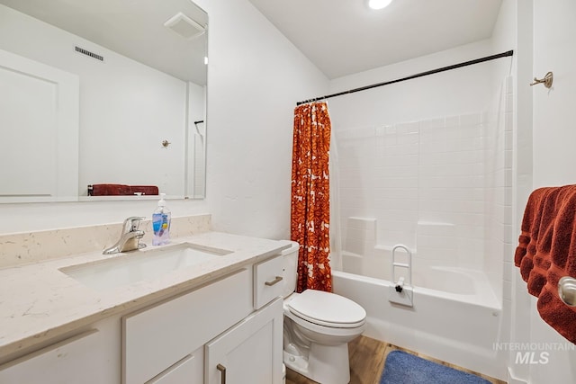 11002 W Hidden Point St, Star, ID 83669 - bathroom featuring toilet, shower / tub combo with curtain, vanity, and wood finished floors