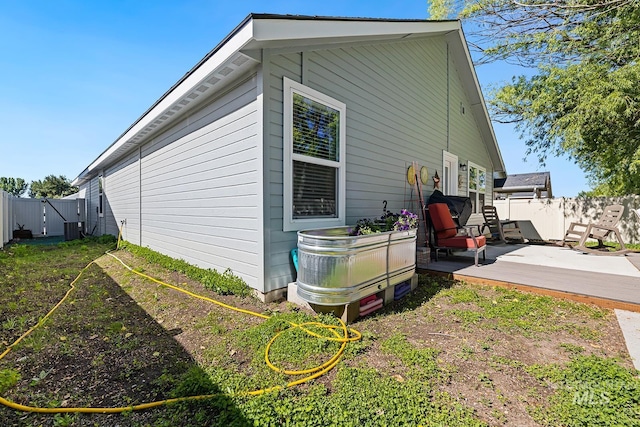 11002 W Hidden Point St, Star, ID 83669 - view of home's exterior featuring a fenced backyard, a deck, and central AC unit