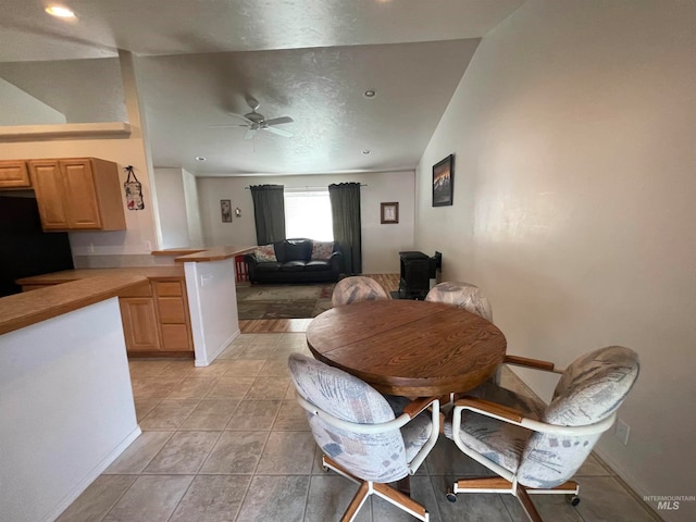 dining space featuring ceiling fan