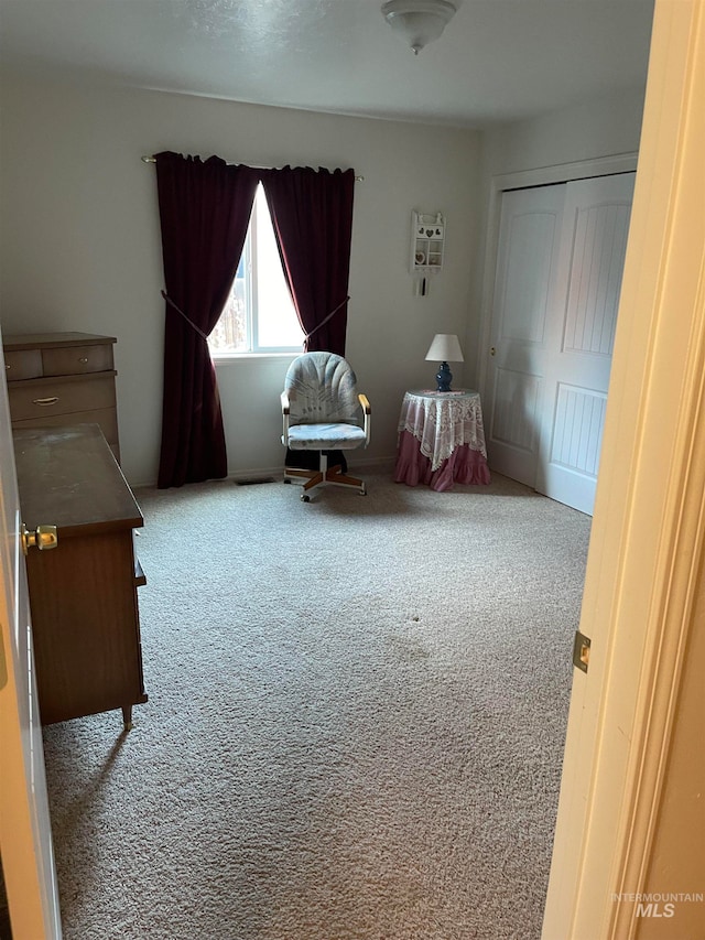 bedroom with a closet and carpet flooring