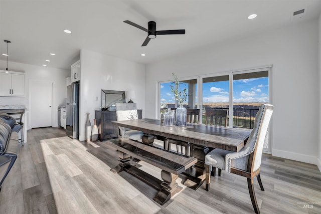 dining space featuring ceiling fan, plenty of natural light, and light hardwood / wood-style flooring