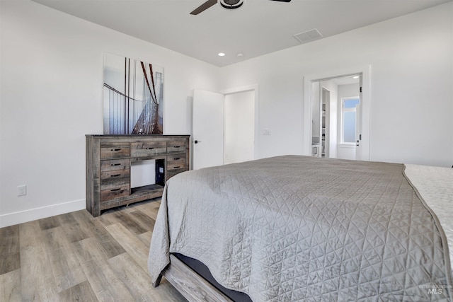 bedroom with visible vents, baseboards, light wood-type flooring, recessed lighting, and a ceiling fan