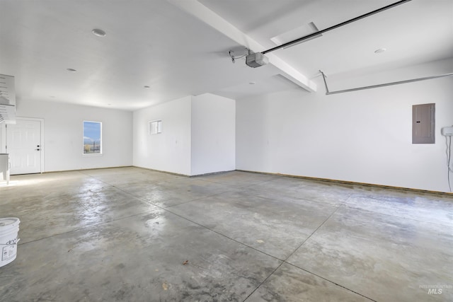 garage featuring electric panel, a garage door opener, and baseboards