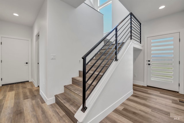 staircase featuring hardwood / wood-style floors