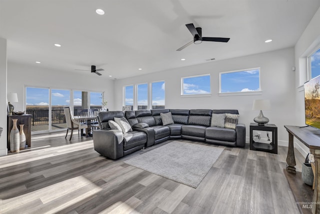 living room featuring recessed lighting, wood finished floors, and a ceiling fan