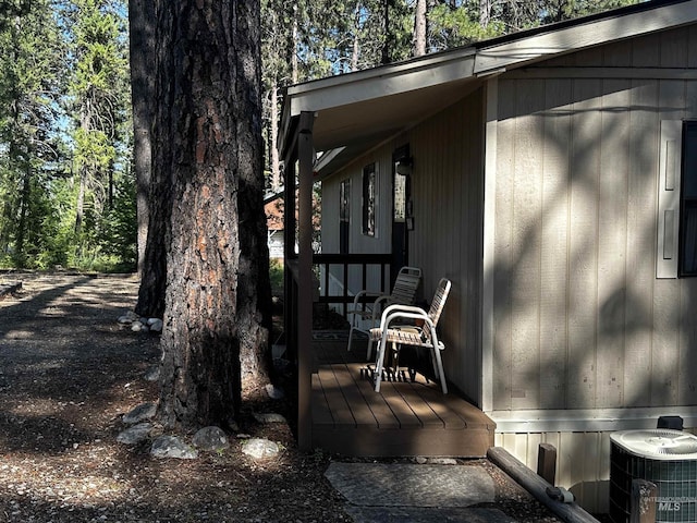 view of property exterior featuring central AC and a wooden deck