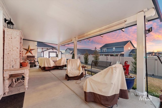 view of patio terrace at dusk