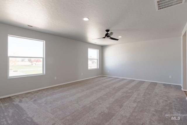 2853 N Eagle Meadow Ave, Kuna, ID 83634 - spare room featuring ceiling fan, carpet, and a textured ceiling