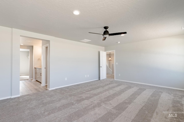 2853 N Eagle Meadow Ave, Kuna, ID 83634 - spare room featuring ceiling fan, light colored carpet, and a textured ceiling