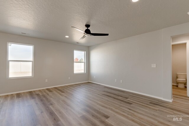2853 N Eagle Meadow Ave, Kuna, ID 83634 - unfurnished room featuring ceiling fan, a textured ceiling, and light hardwood / wood-style floors
