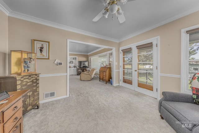 2371 SW 2nd Ave, Ontario, OR 97914 - living area with french doors, ornamental molding, a ceiling fan, carpet, and plenty of natural light