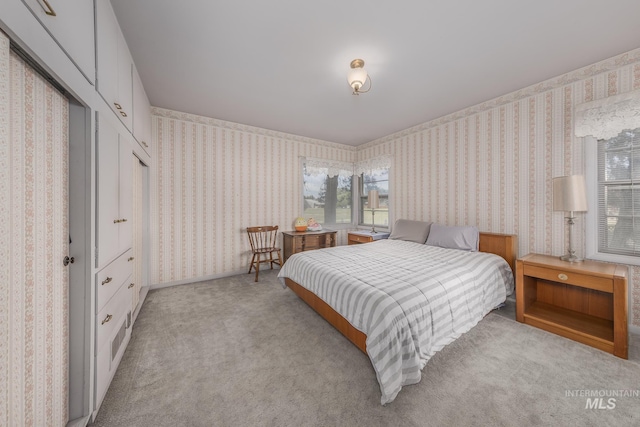 2371 SW 2nd Ave, Ontario, OR 97914 - carpeted bedroom featuring wallpapered walls and multiple windows