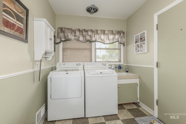 2371 SW 2nd Ave, Ontario, OR 97914 - washroom with cabinet space and washer and dryer