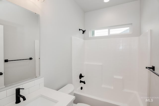 full bath featuring toilet, decorative backsplash, vanity, and shower / bathtub combination