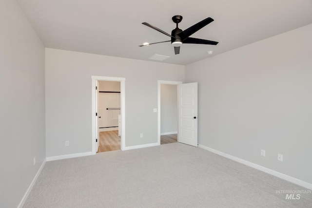 unfurnished bedroom with baseboards, visible vents, and carpet floors