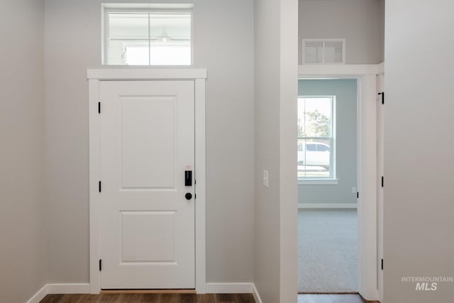 entrance foyer featuring baseboards and visible vents