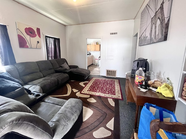 living room featuring visible vents