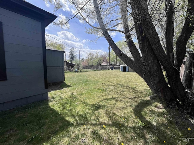 view of yard with fence and cooling unit