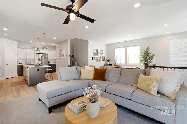 4153 E Raincloud Ln, Boise, ID 83716 - living room with recessed lighting, a ceiling fan, light wood-style flooring, and stairway