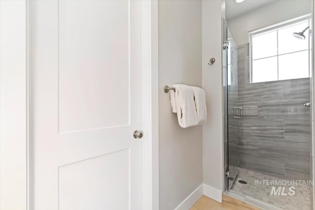 4153 E Raincloud Ln, Boise, ID 83716 - bathroom featuring a shower stall and baseboards