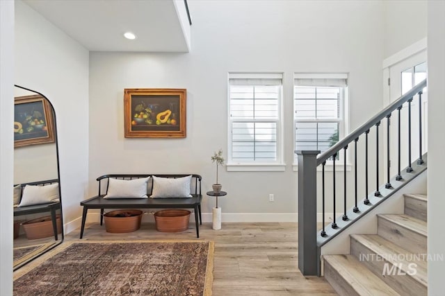 4153 E Raincloud Ln, Boise, ID 83716 - foyer with light wood finished floors, stairway, and recessed lighting