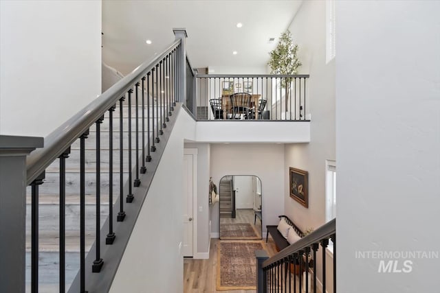 4153 E Raincloud Ln, Boise, ID 83716 - stairs featuring a high ceiling, wood finished floors, and recessed lighting