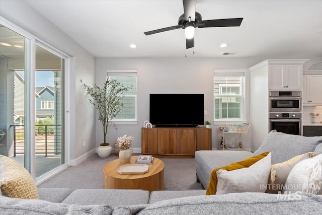 4153 E Raincloud Ln, Boise, ID 83716 - living room with light colored carpet, plenty of natural light, a ceiling fan, and recessed lighting