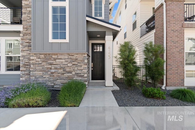 4153 E Raincloud Ln, Boise, ID 83716 - view of exterior entry featuring board and batten siding and stone siding
