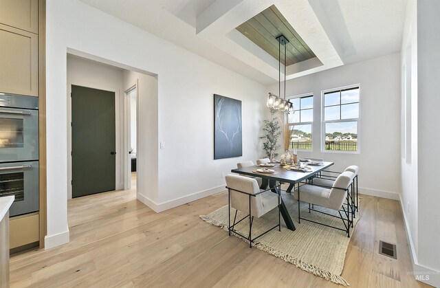 3496 W Parodin St, Eagle, ID 83616 - dining space featuring light wood-style flooring, baseboards, and a chandelier