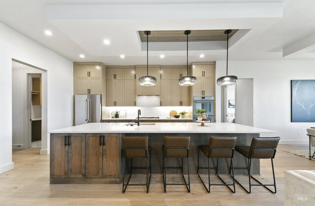 3496 W Parodin St, Eagle, ID 83616 - kitchen featuring high quality fridge, a raised ceiling, a spacious island, baseboards, and recessed lighting