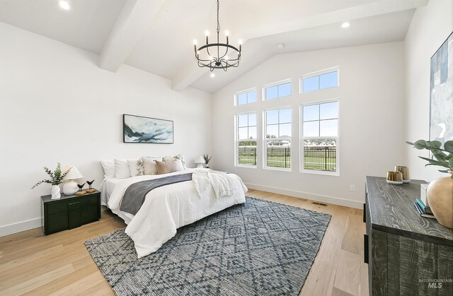 3496 W Parodin St, Eagle, ID 83616 - bedroom with a chandelier, vaulted ceiling, light wood-style floors, baseboards, and recessed lighting