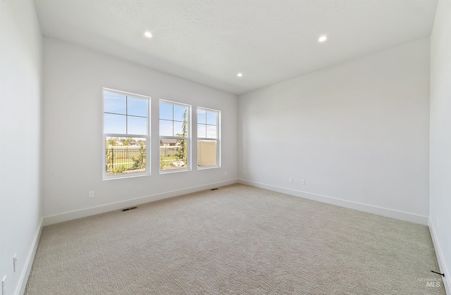 3496 W Parodin St, Eagle, ID 83616 - empty room with light carpet, recessed lighting, and baseboards
