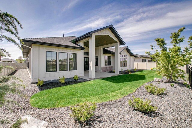 3496 W Parodin St, Eagle, ID 83616 - rear view of house featuring board and batten siding, a patio area, and a shingled roof