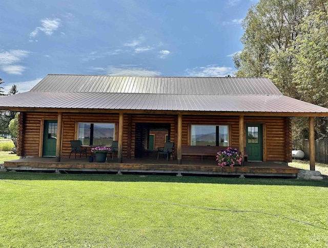 back of house featuring a lawn