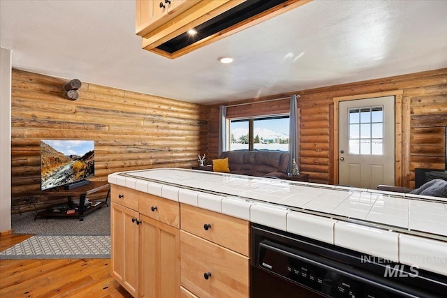 kitchen featuring dishwasher, light wood-type flooring, tile counters, and light brown cabinets