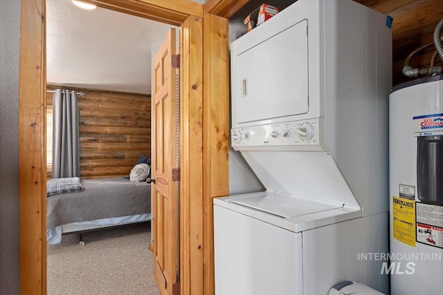 laundry room featuring light carpet, stacked washer and dryer, log walls, and electric water heater