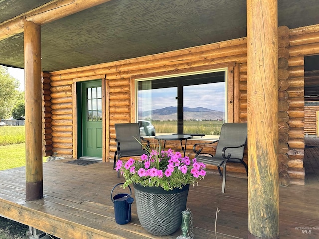 wooden terrace featuring a mountain view