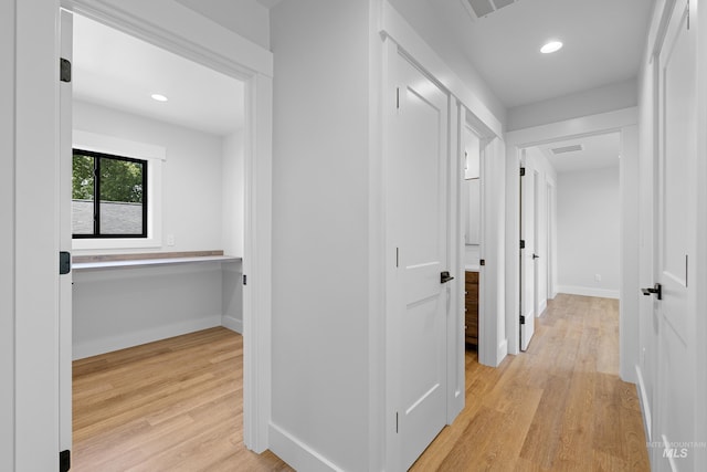 corridor featuring light hardwood / wood-style flooring