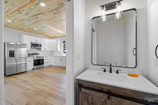 bathroom featuring vanity, decorative backsplash, hardwood / wood-style flooring, and wood ceiling