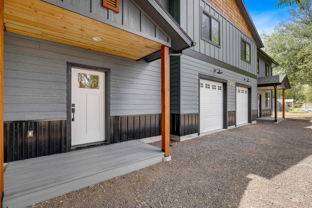 view of exterior entry with a garage