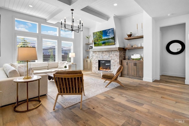 living area featuring a fireplace, light wood-style floors, recessed lighting, beamed ceiling, and baseboards