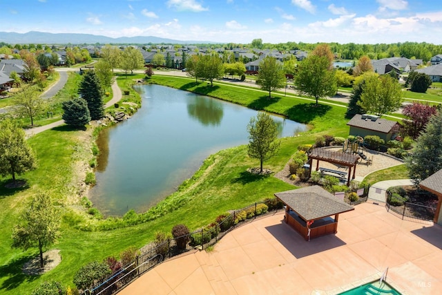 aerial perspective of suburban area with a nearby body of water