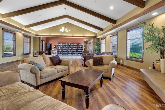 living area featuring a chandelier, recessed lighting, wood finished floors, and baseboards