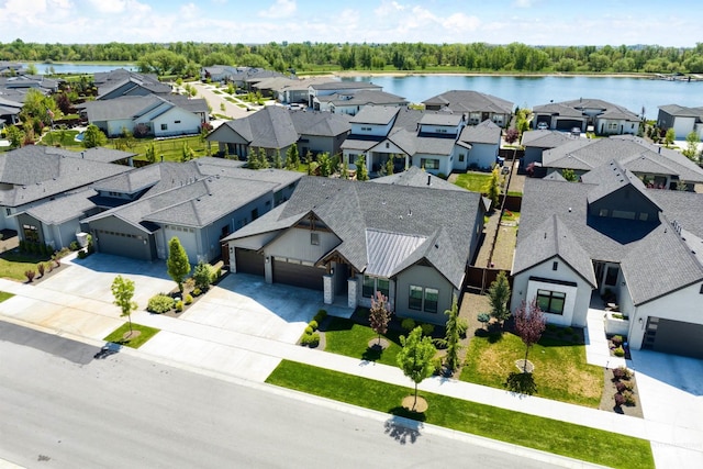 aerial view of residential area with a large body of water