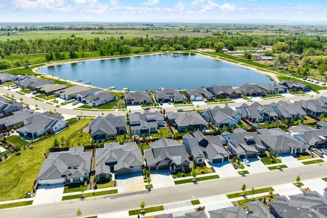 aerial perspective of suburban area featuring a nearby body of water