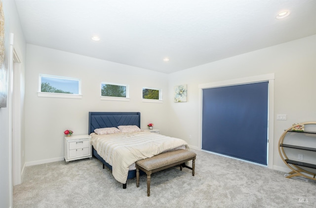 bedroom with light colored carpet